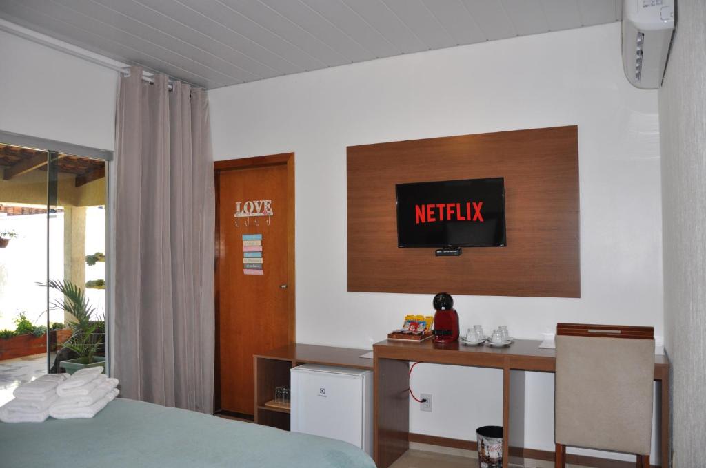 Postel nebo postele na pokoji v ubytování Pousada Suites Bougainville