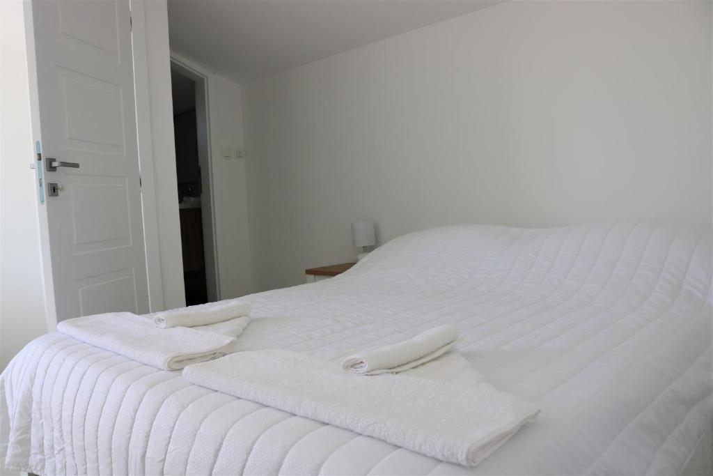 Postel nebo postele na pokoji v ubytování City Center Chic Apartments