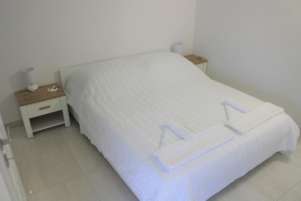 Postel nebo postele na pokoji v ubytování City Center Chic Apartments