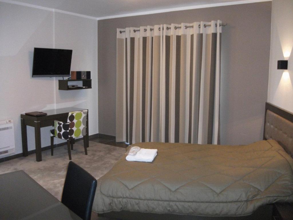 TV a/nebo společenská místnost v ubytování Castello Hotel