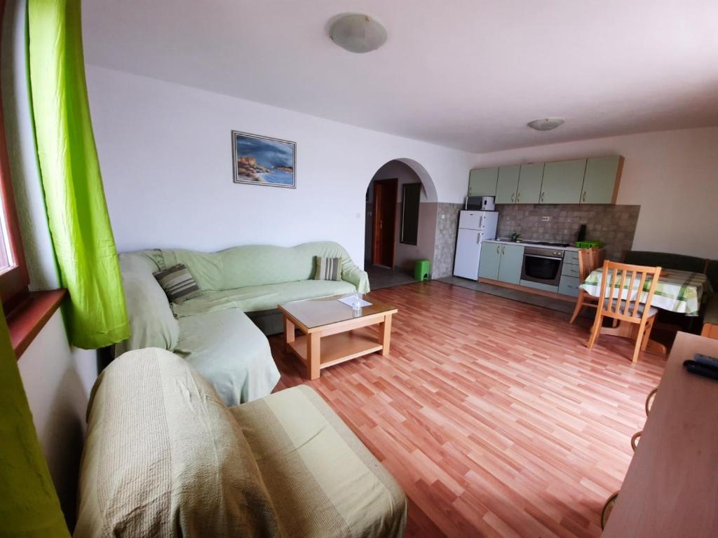 a living room with a couch and a table at Vila Mia in Prizba