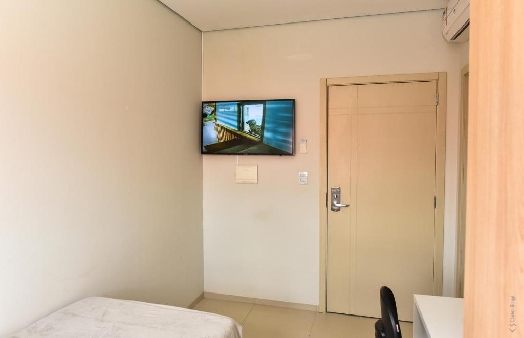 TV a/nebo společenská místnost v ubytování Hotel Plaza Garden
