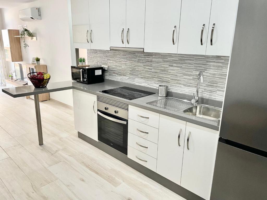 A kitchen or kitchenette at ISLAND SUITES