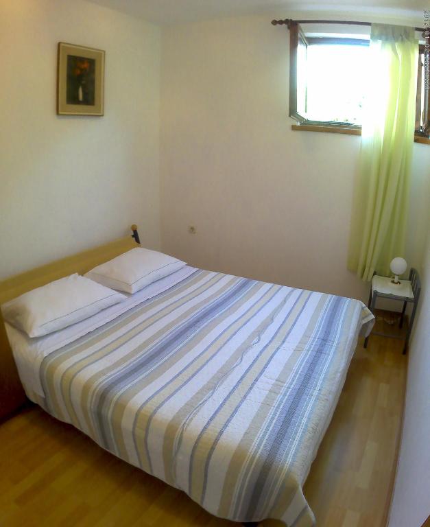 Postel nebo postele na pokoji v ubytování Apartmani Mediteran Copic
