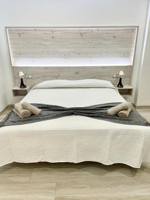 A bed or beds in a room at ISLAND SUITES