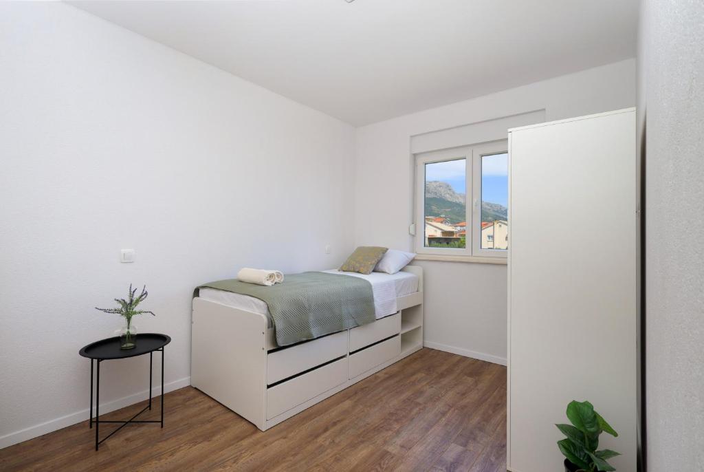 Posteľ alebo postele v izbe v ubytovaní Bonaca apartments with terrace, barbecue and private parking