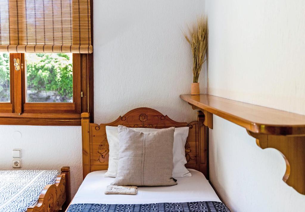 A bed or beds in a room at Casa Gaia