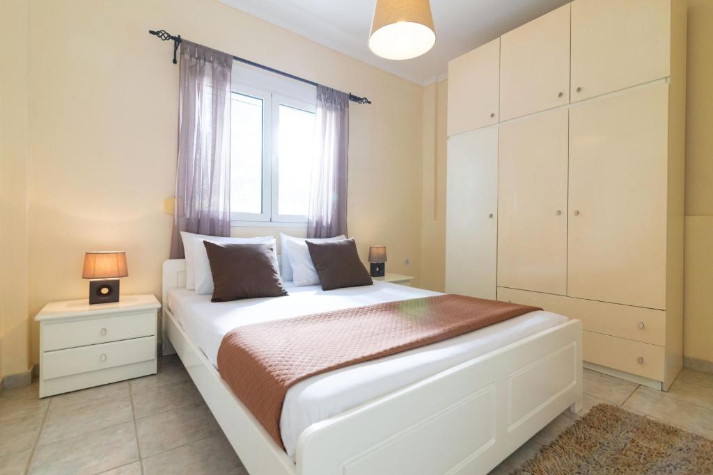 Postel nebo postele na pokoji v ubytování F & B Summer Collection - Paliouri