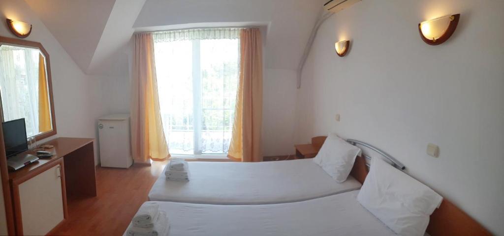 Postel nebo postele na pokoji v ubytování Hotel Aia Kavatsi