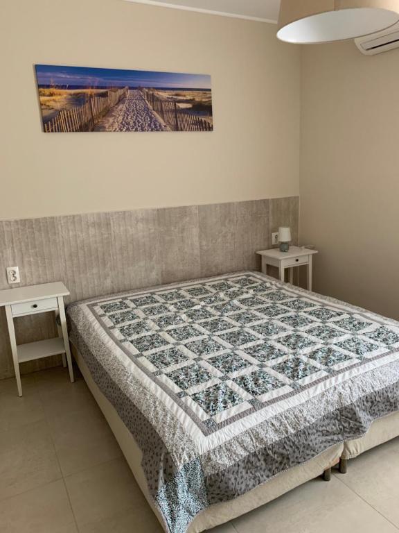 Posteľ alebo postele v izbe v ubytovaní TópART Apartman I