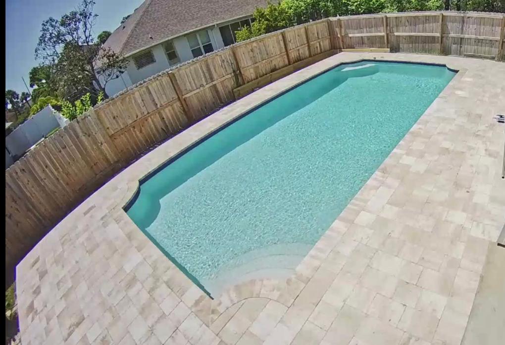 The swimming pool at or close to Three Palms Tree Home