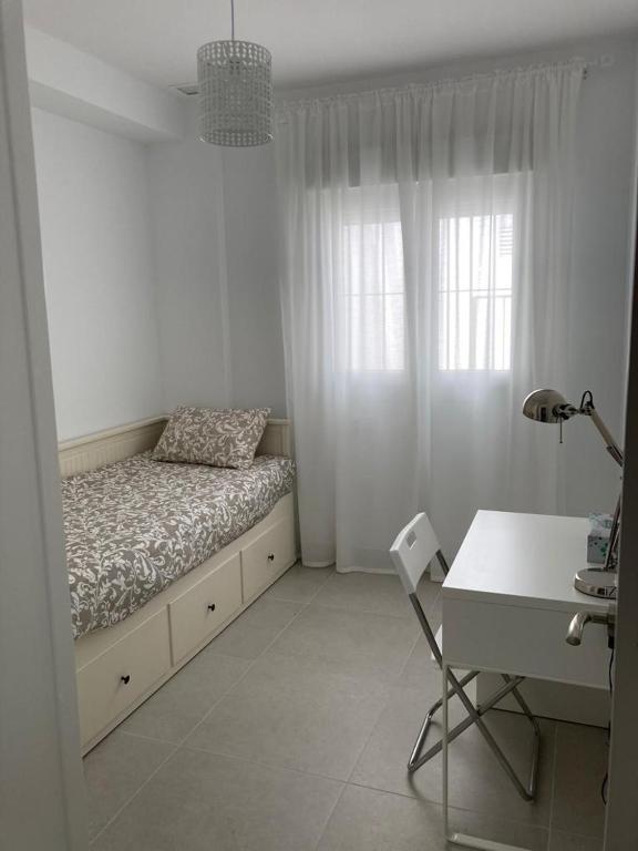 Posteľ alebo postele v izbe v ubytovaní APARTAMENTO SAN JUAN