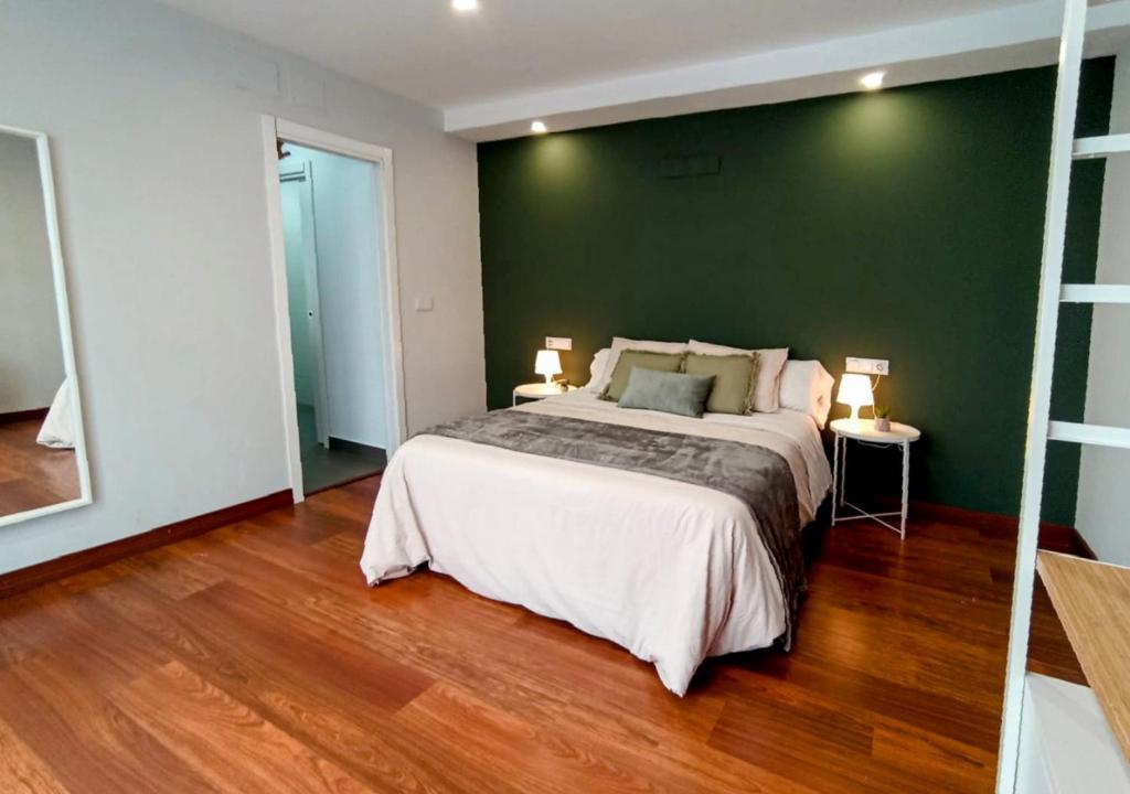 Posteľ alebo postele v izbe v ubytovaní Apartamentos LOS GATA GATA