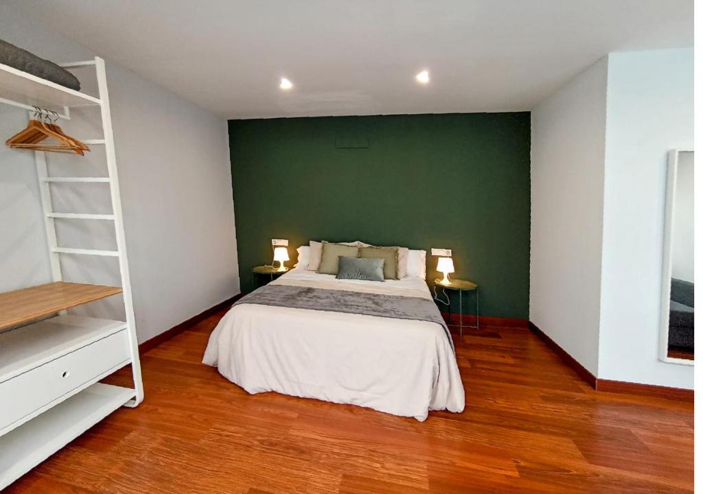 Posteľ alebo postele v izbe v ubytovaní Apartamentos LOS GATA GATA