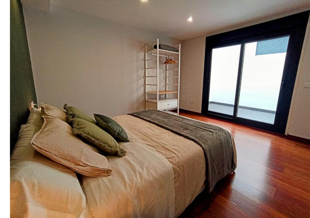 Posteľ alebo postele v izbe v ubytovaní Apartamentos LOS GATA GATA