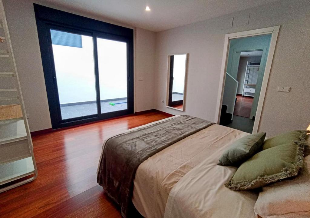 Posteľ alebo postele v izbe v ubytovaní Apartamentos LOS GATA GATA
