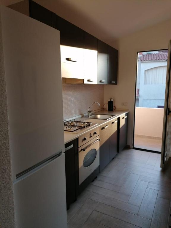Kuchyň nebo kuchyňský kout v ubytování La Casa di su