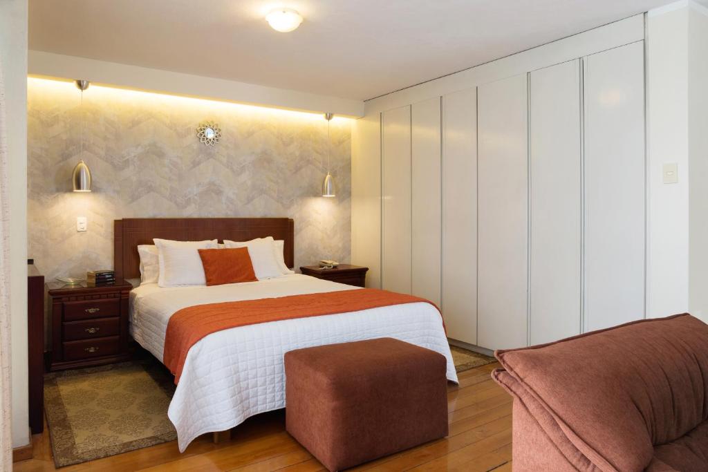 Postel nebo postele na pokoji v ubytování Suites Metropoli