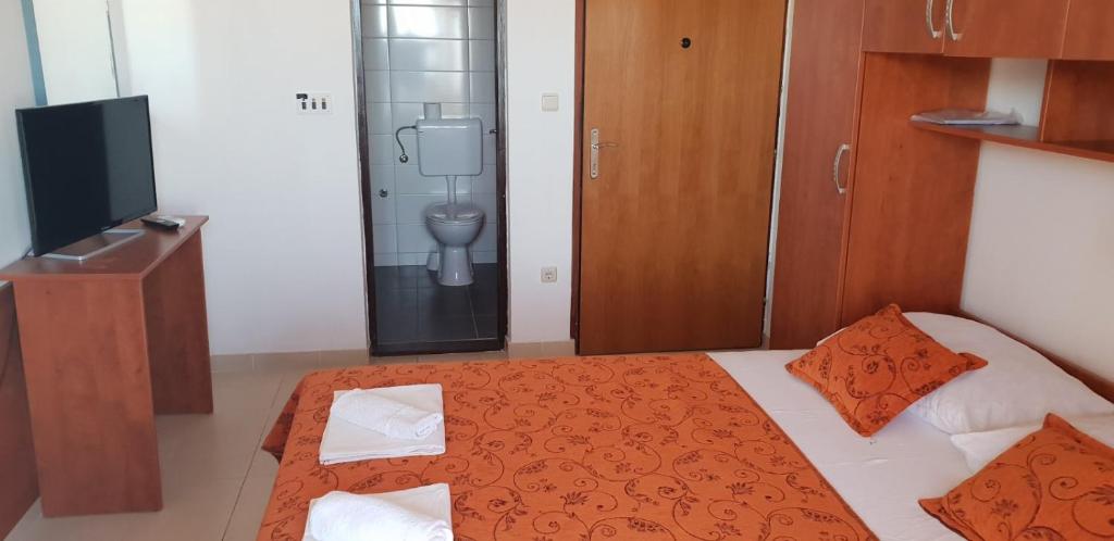 Postel nebo postele na pokoji v ubytování Kuća Pećine