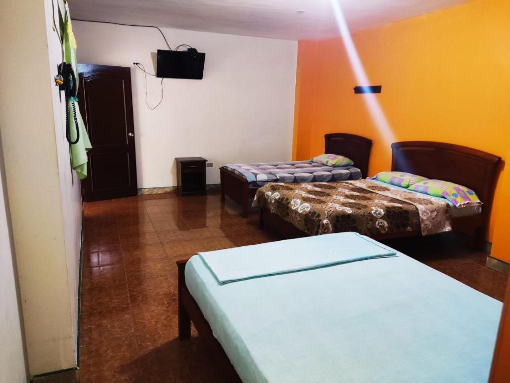 Postel nebo postele na pokoji v ubytování Hotel Boston