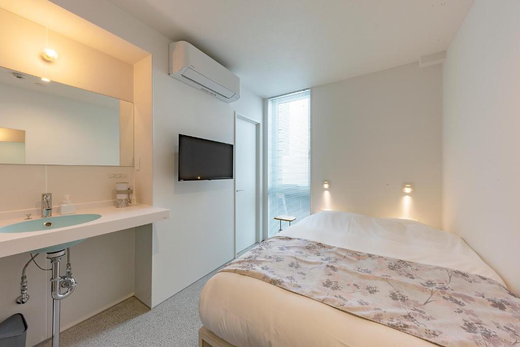 Postel nebo postele na pokoji v ubytování plat hostel keikyu kamakura wave