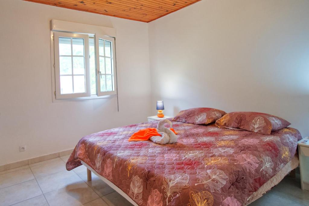 Postel nebo postele na pokoji v ubytování Charmant logement F3 au sud de la Martinique (PMR)