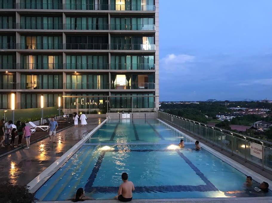 a swimming pool on the roof of a building at Imperial Suites Apartments in Kuching