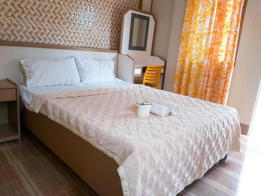 Postel nebo postele na pokoji v ubytování Stefanie Grace Paradise Inn