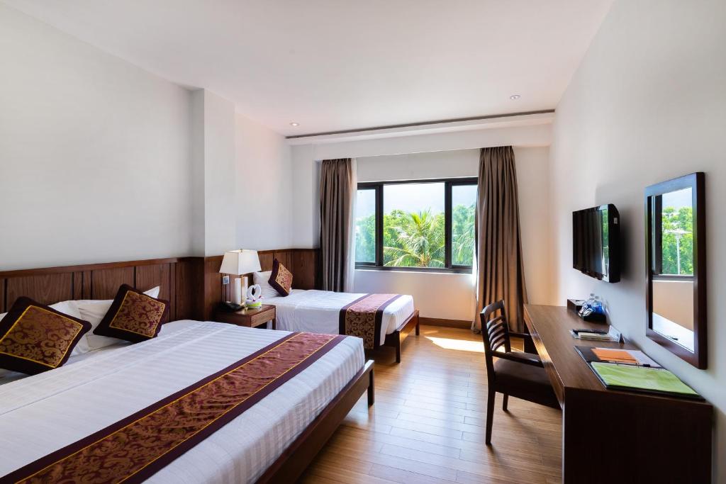 Postel nebo postele na pokoji v ubytování Con Dao Resort