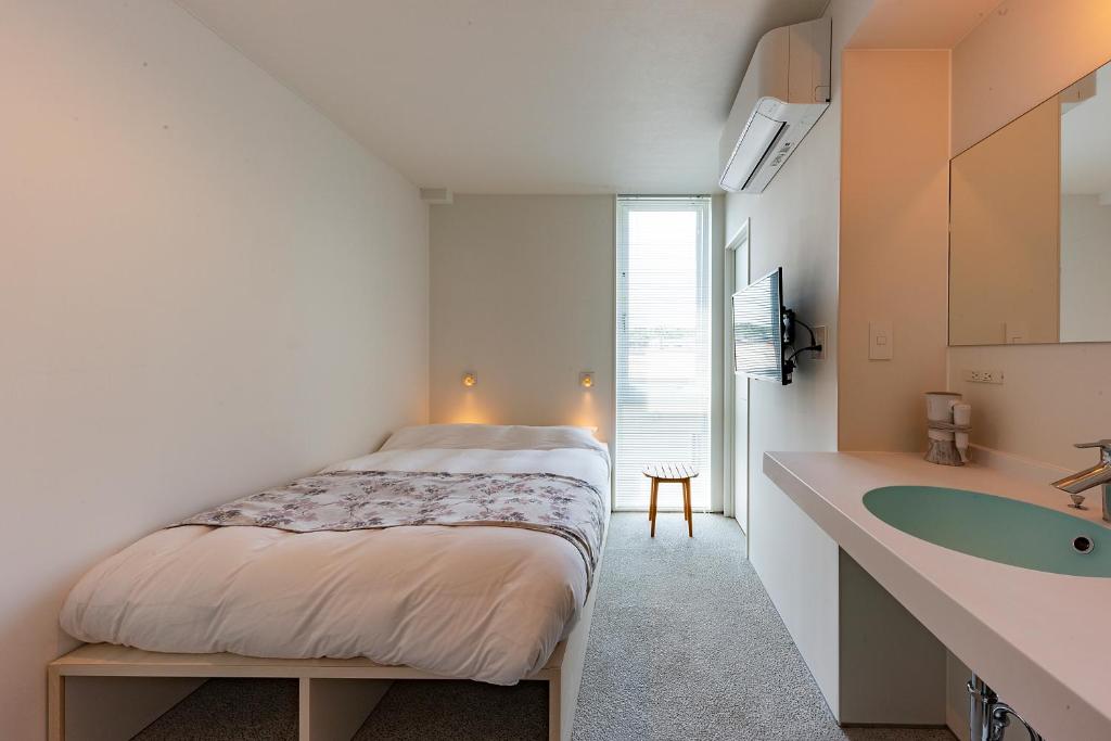 Postel nebo postele na pokoji v ubytování plat hostel keikyu kamakura wave