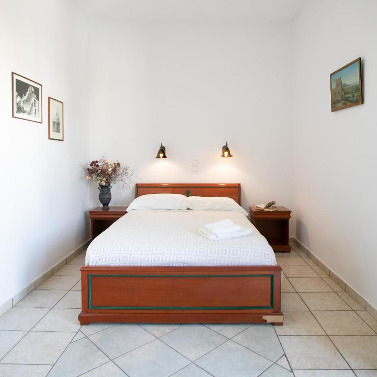 Postel nebo postele na pokoji v ubytování Apollon Hotel
