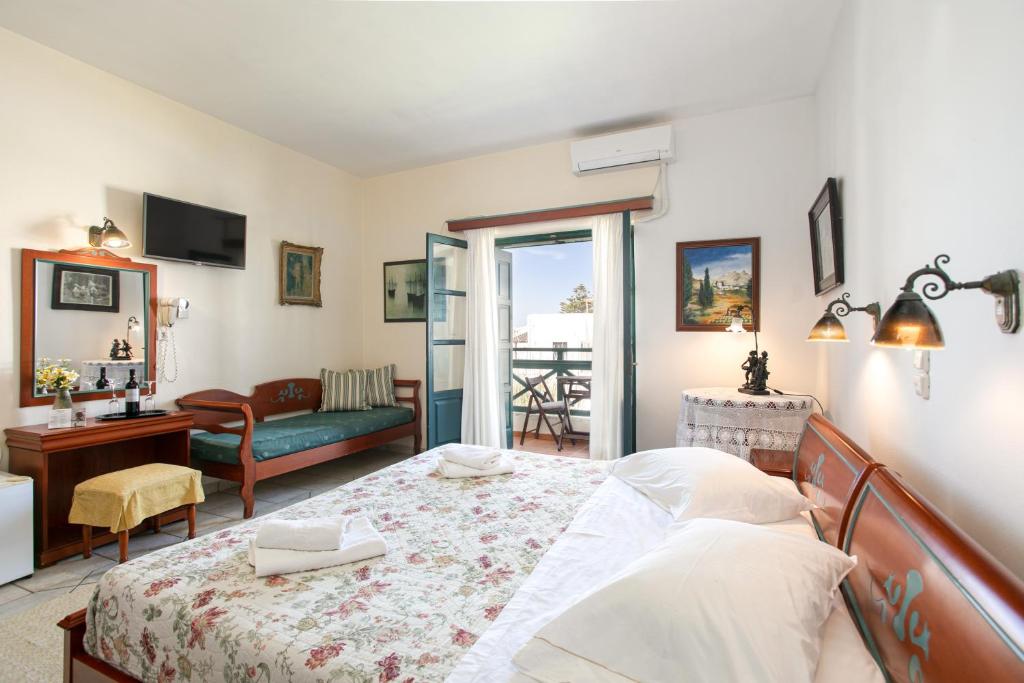 Postel nebo postele na pokoji v ubytování Apollon Hotel