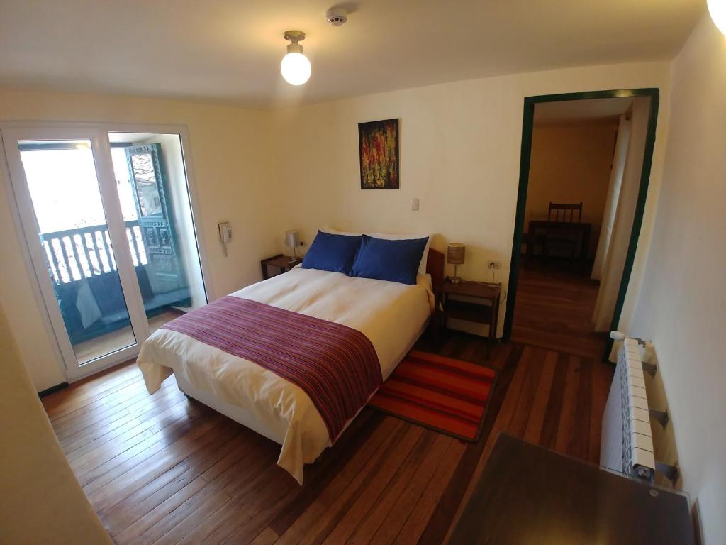 Postel nebo postele na pokoji v ubytování Hostal Corihuasi