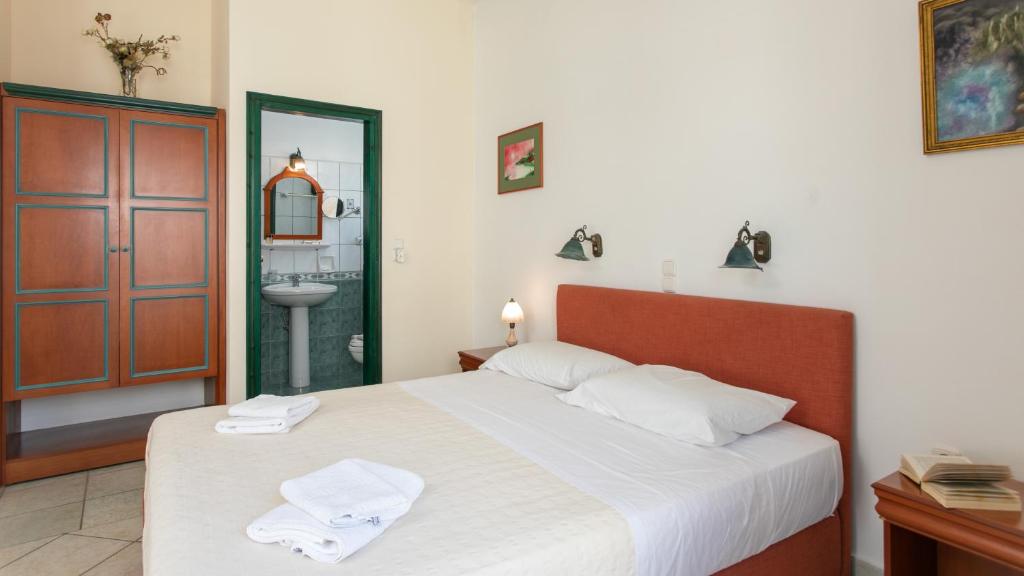 Postel nebo postele na pokoji v ubytování Apollon Hotel