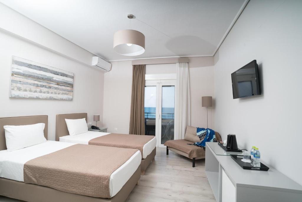 Postel nebo postele na pokoji v ubytování Hotel Alkyon