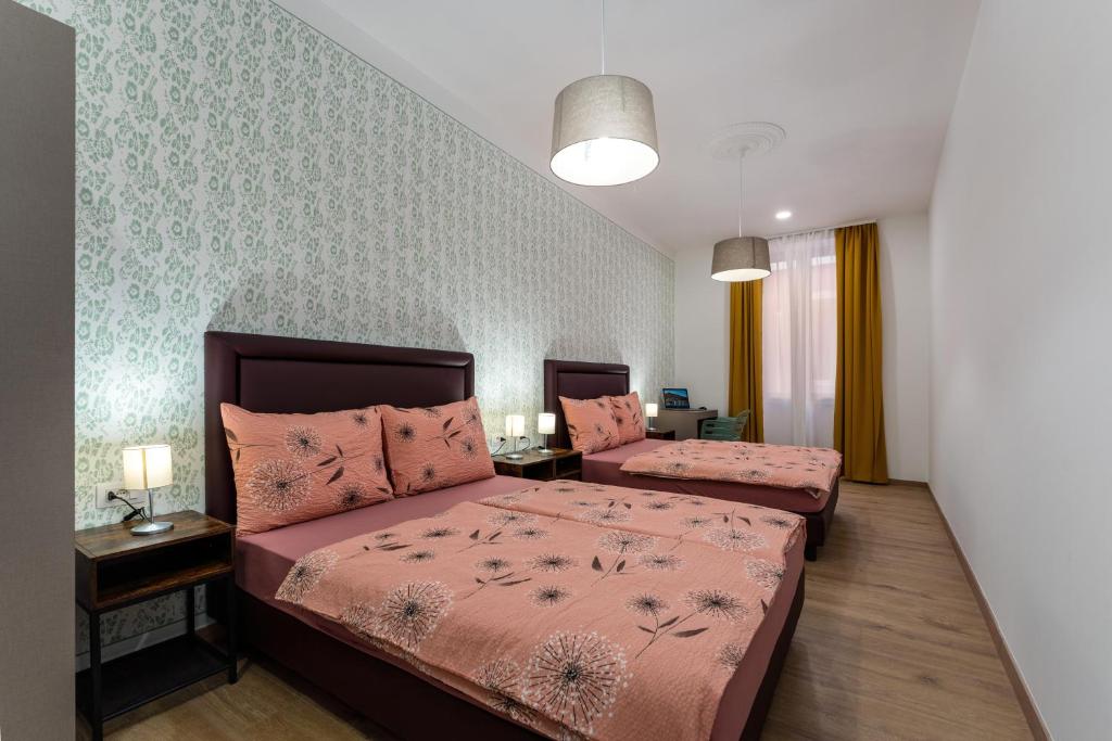 Postel nebo postele na pokoji v ubytování Hostel Antique