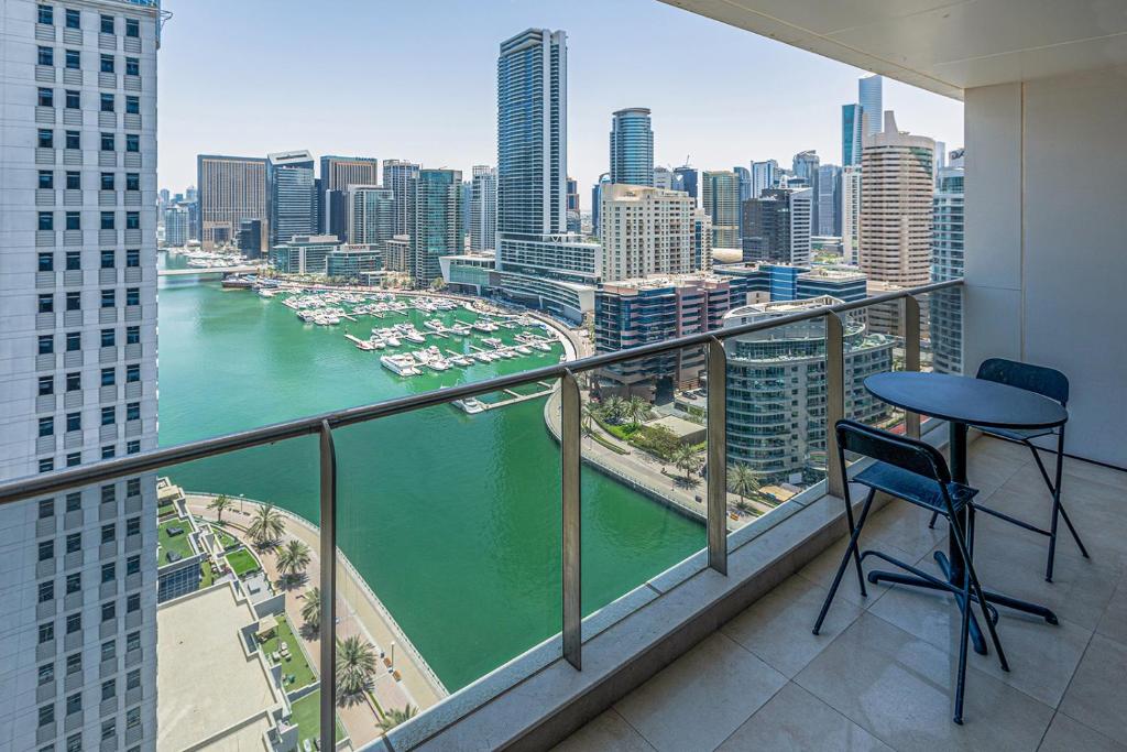 a balcony with a view of a river in a city at Sparkle Tower, Dubai Marina in Dubai