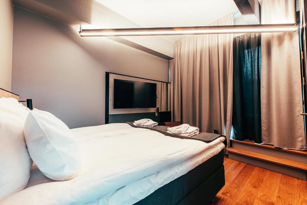 Postel nebo postele na pokoji v ubytování Clarion Hotel Mestari