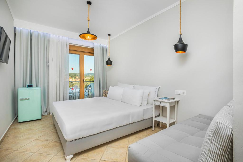 Voodi või voodid majutusasutuse Hesperides Hotel Pefkochori toas