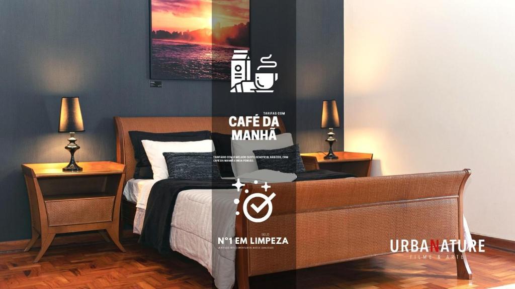 a bedroom with a bed and two tables with lamps at Hostel Urbanature in São Paulo