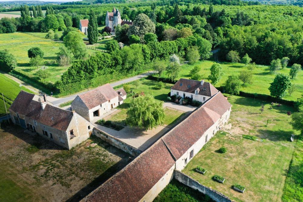 an aerial view of a large house in a field at Domaine de La Vove in Corbon