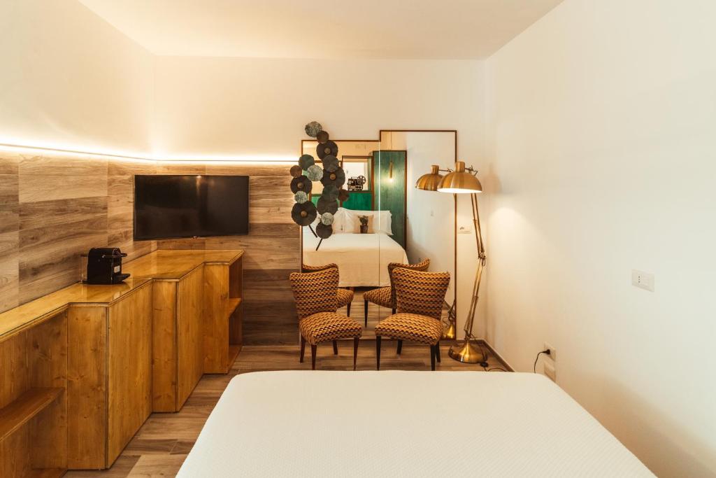 Televízia a/alebo spoločenská miestnosť v ubytovaní Da Riva Suite & Pool - Housea