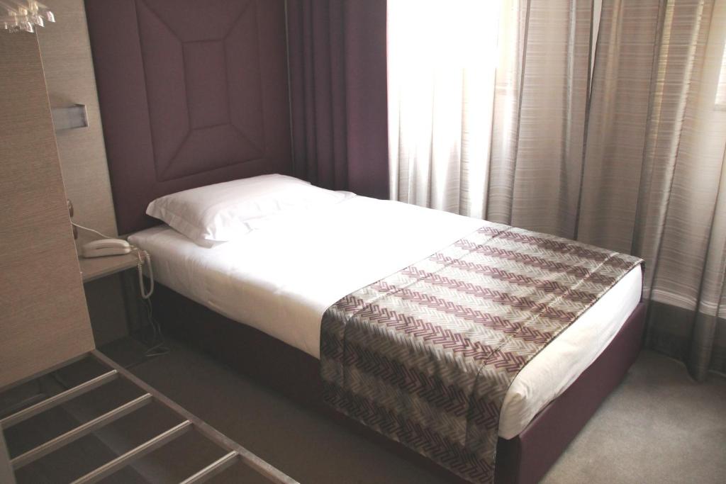 Postel nebo postele na pokoji v ubytování Hotel Soperga