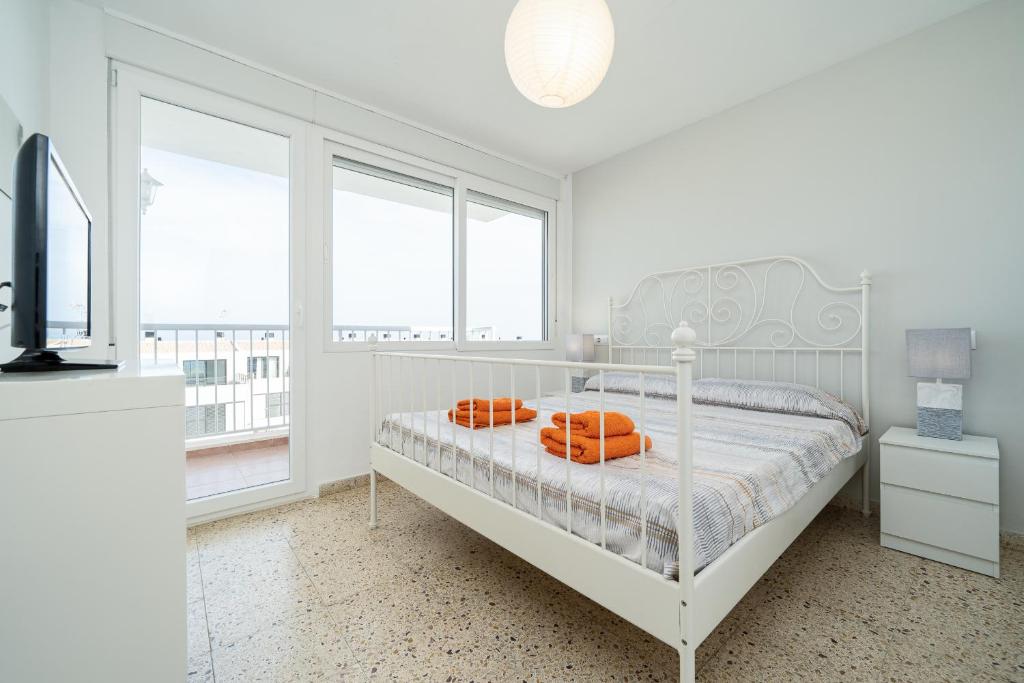 Posteľ alebo postele v izbe v ubytovaní Apartament Esmeralda