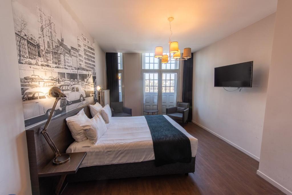 Postel nebo postele na pokoji v ubytování Résidence-Hotel Le Quinze Grand Place Brussels