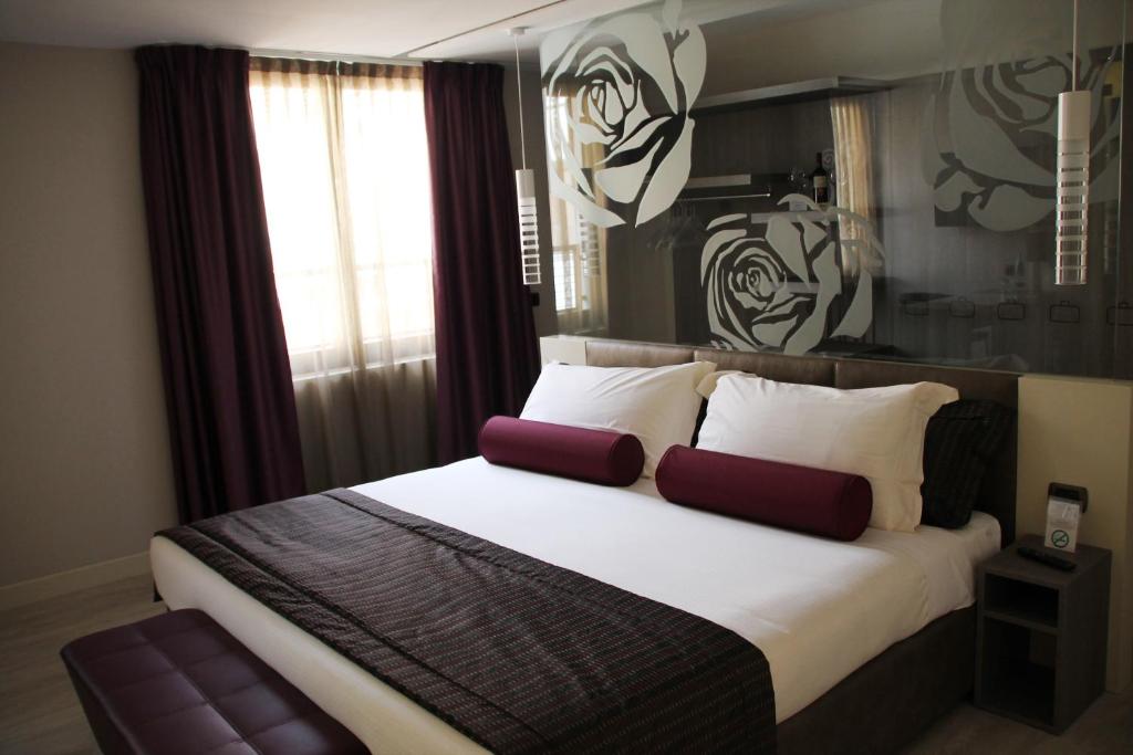 Postel nebo postele na pokoji v ubytování Hotel Soperga