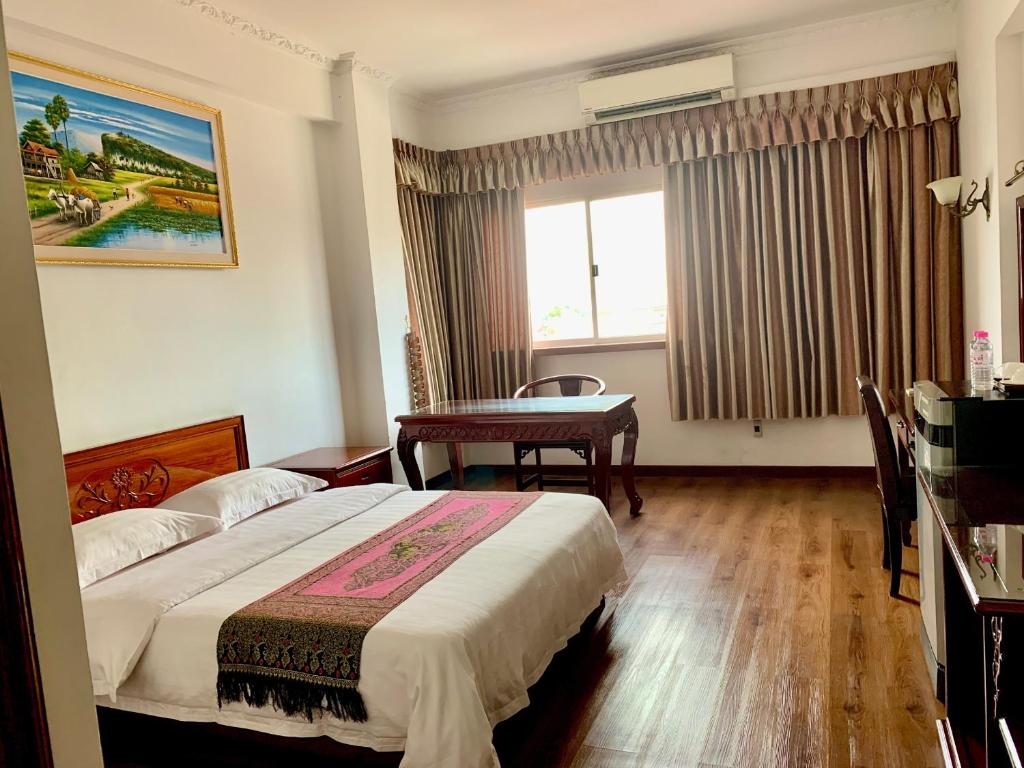 Postel nebo postele na pokoji v ubytování Chung Hsin Hotel 中信酒店