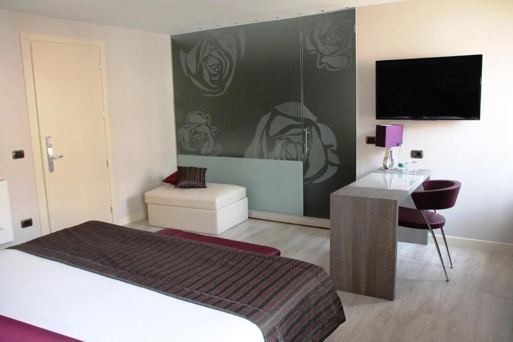 Postel nebo postele na pokoji v ubytování Hotel Soperga