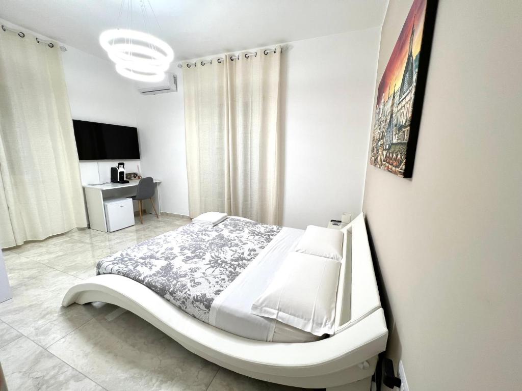 Кровать или кровати в номере Circeo Boutique Rooms