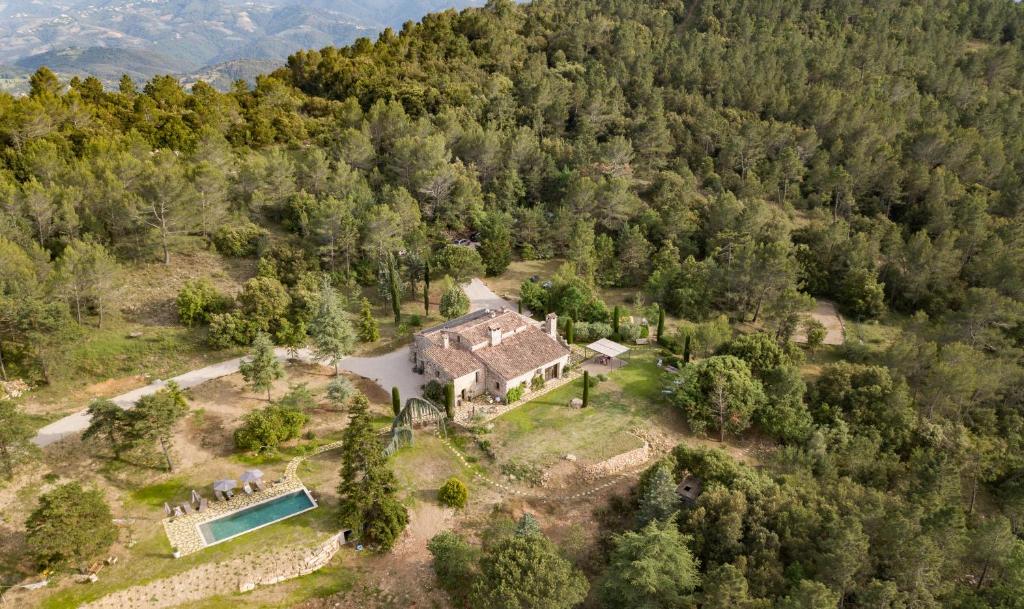 an aerial view of a house in a forest at Domaine de la Xavolière in Saint-Cézaire-sur-Siagne